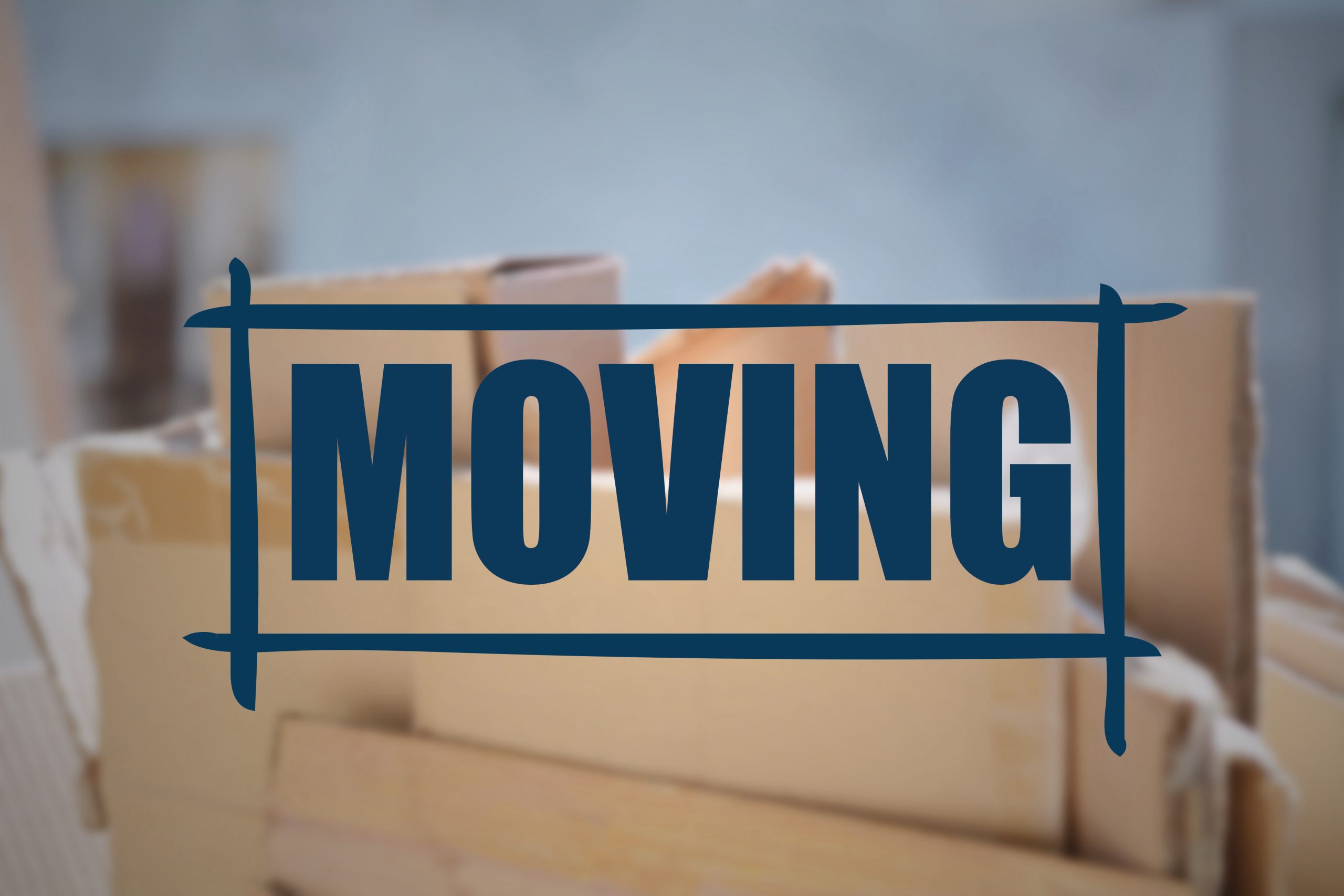 several-cardboard-boxes-with-focus-on-moving-tex-2026-01-11-10-00-11-utc